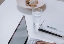 How to earn money by writing and blogging about cryptocurrency projects? person in white long sleeve shirt using macbook pro